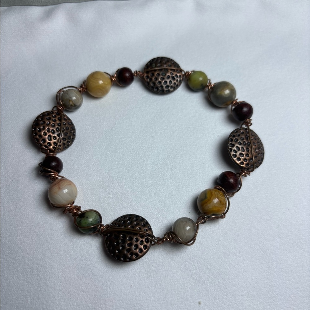 Elegant Beaded Bracelet with Bronze Accents